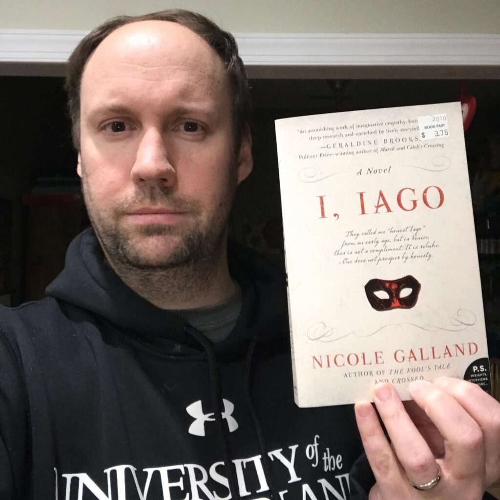 Matt holding up the "I, Iago" book.