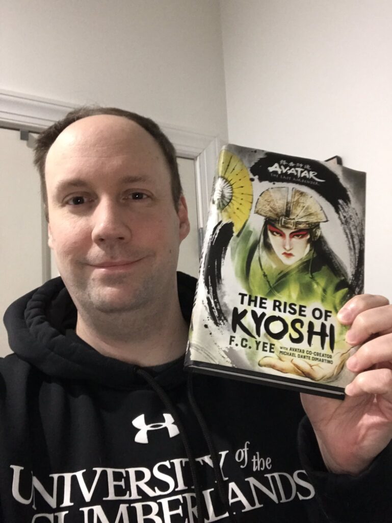 Matt holding up the "Rise of Kyoshi" book.